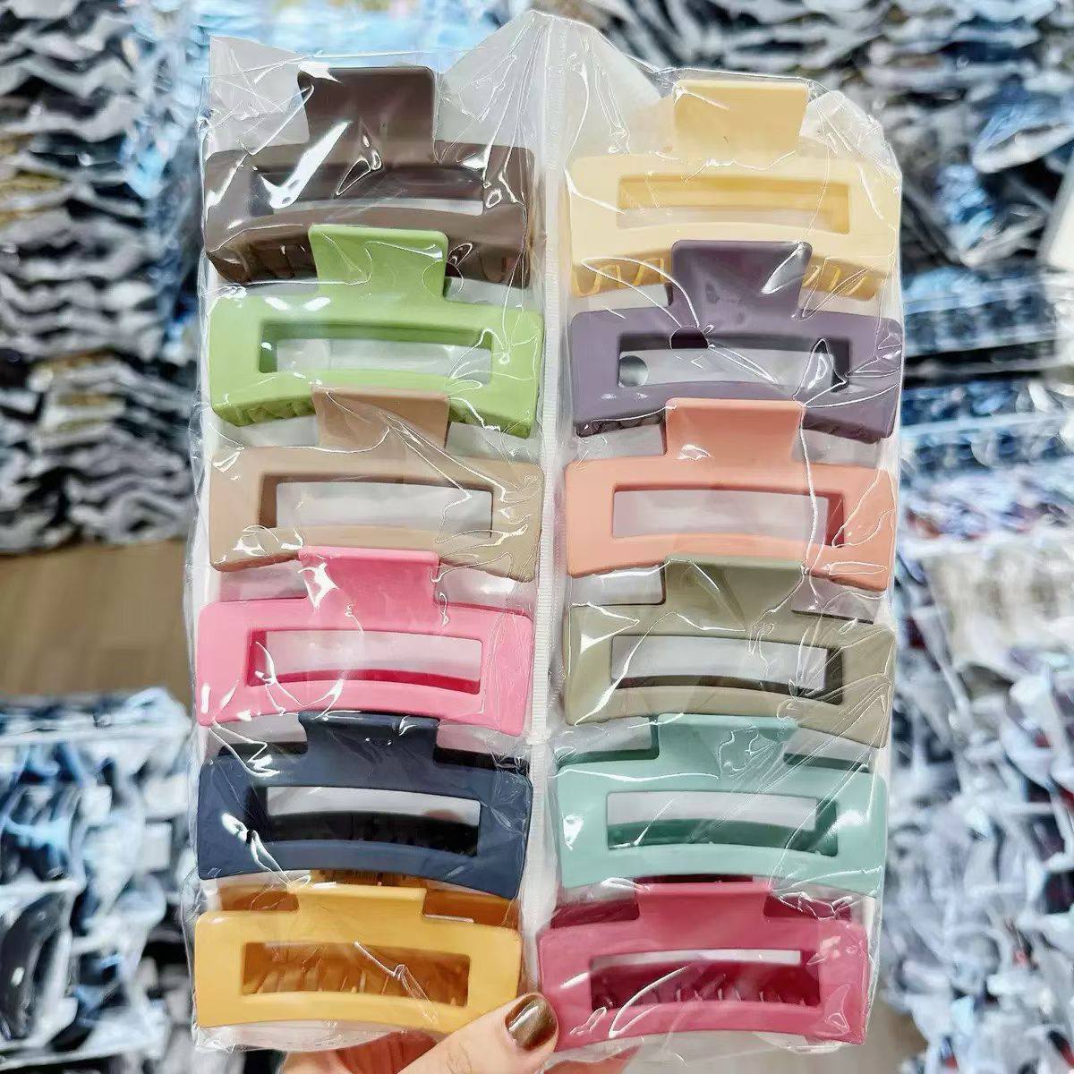 Individually bagged hair claw clips with packed stock behind them